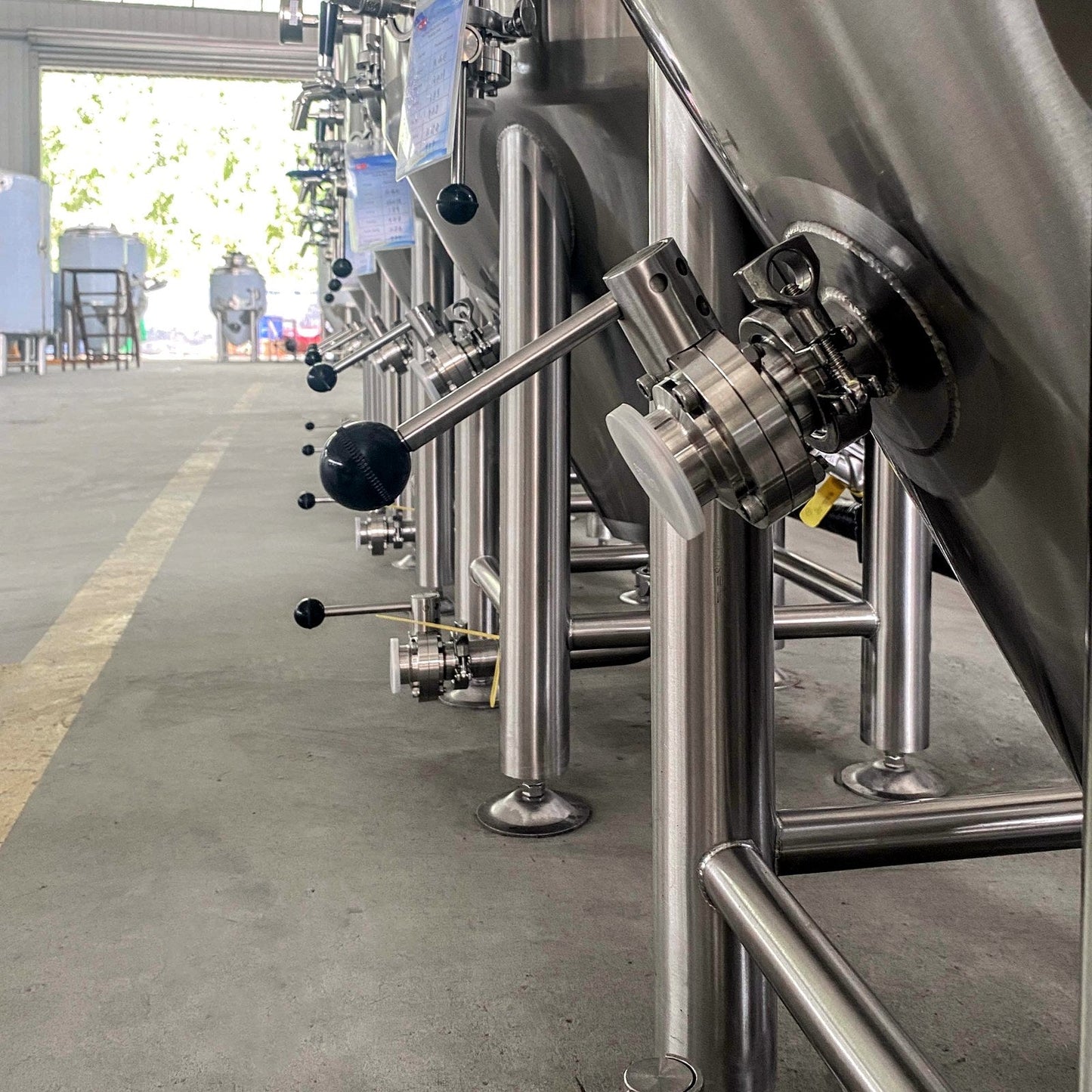 Row of BrewTaurus PRO 100L conical fermenters ready for shipment