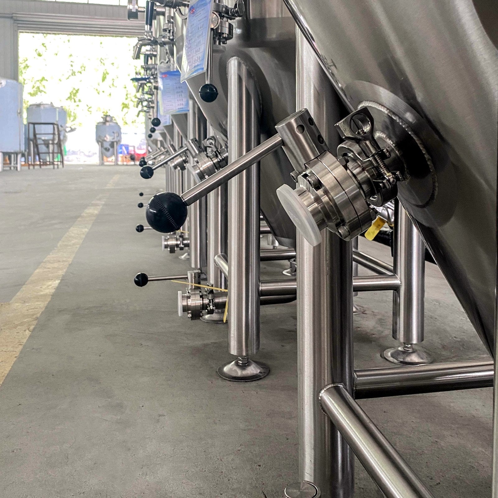 Row of BrewTaurus PRO 100L conical fermenters ready for shipment